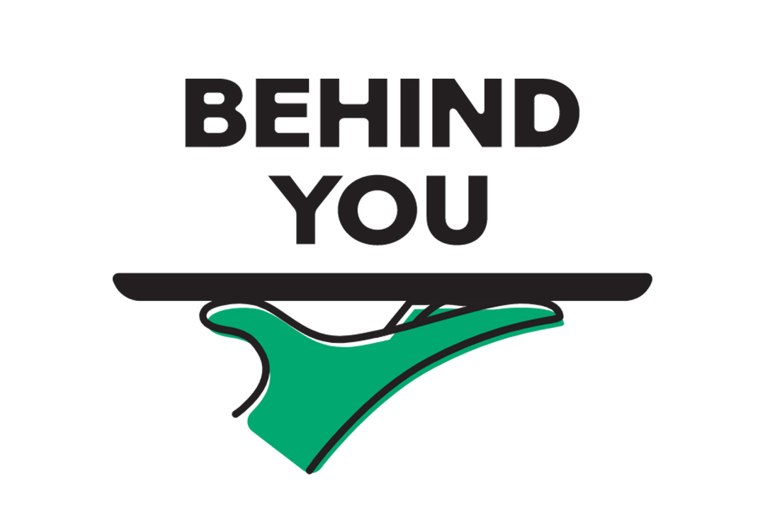 Behind You above an illustration of a green hand holding up a tray